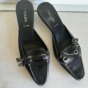 Prada Women's Black Leather Mules with Bow Detail